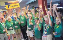  ?? GREG SORBER/JOURNAL ?? Senior athletes from Vermont show their spirt as they cheer during the National Senior Games Parade of Athletes at Dreamstyle Arena - the Pit on Wednesday night.