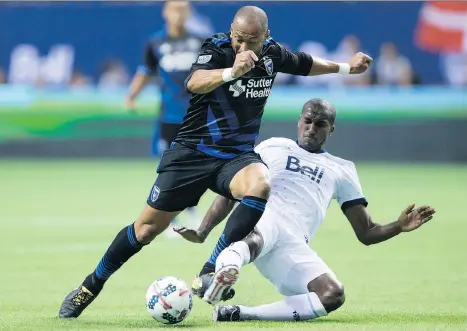  ?? DARRYL DYCK/THE CANADIAN PRESS ?? Whitecaps midfielder Aly Ghazal, right, says Saturday’s game against New England is “very, very important.”