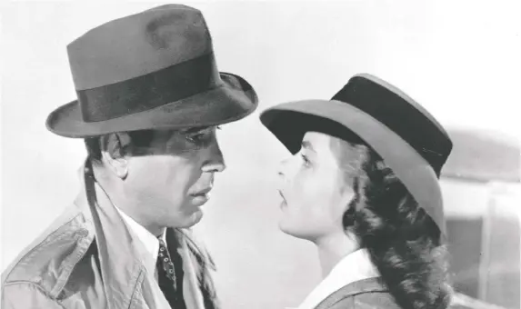  ?? PHOTOS: WARNER BROS. ?? Humphrey Bogart and Ingrid Bergman, seen above and below, were granted only a brief kiss in Casablanca to comply with the Production Code of the day. Now, as physical distancing rules are changing the way actors portray intimacy, some shows are enforcing virus testing, while others are using dummies.