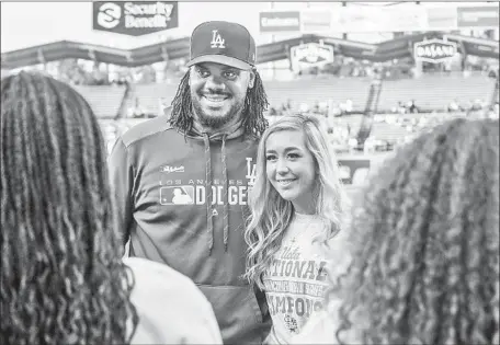  ?? Photograph­s by Allen J. Schaben Los Angeles Times ?? STEVIE WISZ and Kenley Jansen meet before a game at Dodger Stadium. Says the Dodgers closer about the UCLA softball player: “We’re both heart patients. Just to hear what she went through is tough. It’s not a good feeling. It inspired me seeing how tough she is.”