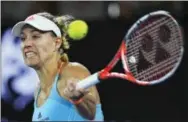  ?? ANDY BROWNBILL — THE ASSOCIATED PRESS ?? Germany’s Angelique Kerber makes a forehand return to the United States’ Coco Vandeweghe during their fourth round match Sunday.