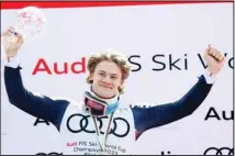  ?? (AP) ?? Norway’s Lucas Braathen celebrates on the podium with the alpine ski, men’s World Cup slalom discipline trophy, in Soldeu, Andorra.