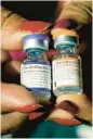  ?? ROGELIO V. SOLIS/AP ?? Pfizer’s COVID-19 vaccine for kids 5 to 11, left, and for adults.