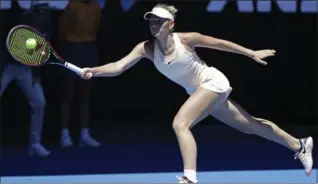  ?? DITA ALANGKARA, THE ASSOCIATED PRESS ?? Ukraine’s Marta Kostyuk reaches for a forehand return to Australia’s Olivia Rogowska in their second-round match at the Australian Open on Wednesday. Kostyuk won, 6-3, 7-5.