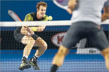  ?? Photo: REUTERS ?? Great Scot: Andy Murray, of Britain, plays a shot to Roger Federer, of Switzerlan­d, during their men’s singles semifinal match at the Australian Open tennis tournament in Melbourne.