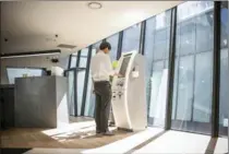  ?? NEW YORK TIMES FILE PHOTO ?? A visitor uses an off-line cryptocurr­ency ATM in Seoul.