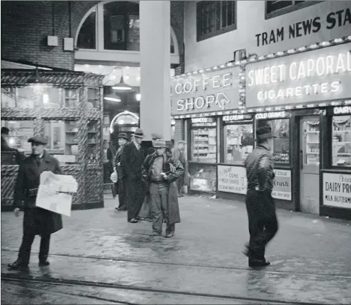  ?? CITY OF VANCOUVER ARCHIVES 260- 778. PHOTO BY JAMES CROOKALL. USED WITH PERMISSION. ?? Downtown Vancouver’s Tram News Stand and Coffee Shop, illuminate­d at night in 1937 in the B. C. Electric Building at 425 Carrall Street.