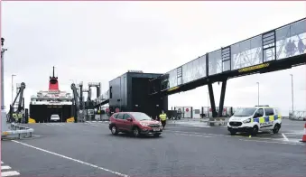  ?? 01_B29capacit­y01 ?? Passengers and cars come off the MV Caledonian Isles after tourism reopened on Wednesday.