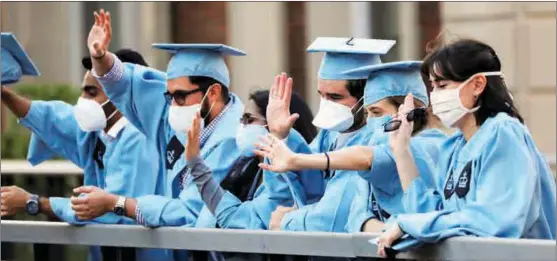  ?? ANDREW KELLY / REUTERS ?? Students from Columbia University in New York the day before their online graduation ceremony on May 15. Many universiti­es joined lawsuits against the US administra­tion.