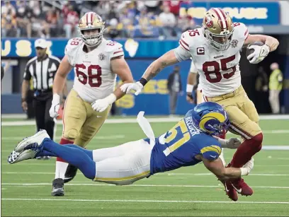  ?? PHOTOS BY MARCIO JOSE SANCHEZ — THE ASSOCIATED PRESS ?? Los Angeles Rams inside linebacker Troy Reeder (51) tackles San Francisco 49ers tight end George Kittle (85) during the second half Sunday in Inglewood.