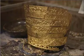  ?? (AP/Efrem Lukatsky) ?? A fourth century B.C. golden ceremonial headgear, an ancient treasure from a Scythian king’s burial mound, is exhibited in the Museum of Historical Treasures last month in Kyiv, Ukraine.