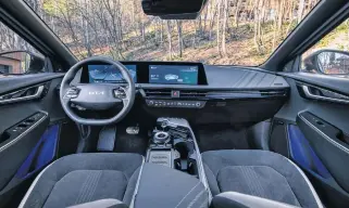  ?? KIA ?? The EV6 mixes high-tech content such as a digitized dashboard with practical elements such as a floating centre console with abundant storage solutions and a large bin underneath it.