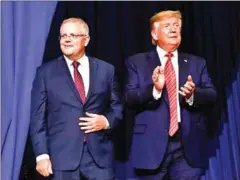  ??  ?? US President Donald Trump and Australian Prime Minister Scott Morrison arrive to speak at a plant opening in Wapakoneta, Ohio during an official state visit last month.