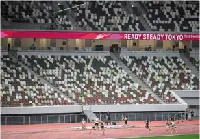  ?? — AFP ?? athletes competing in the 400m race test event for the 2020 Tokyo Olympics at the national Stadium in Tokyo on May 9.