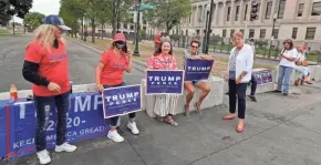  ?? RICK WOOD / MILWAUKEE JOURNAL SENTINEL ?? Women who support President Donald Trump line up along barricades before a Black Lives Matter rally on Tuesday.