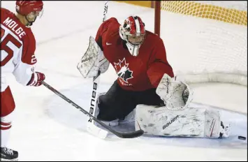  ??  ?? Michael Dipietro makes a save during Friday’s game against Denmark. Dipietro was one of the final cuts from Canada’s entry at the world junior hockey championsh­ip.