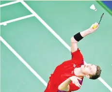  ?? - AFP photo ?? Viktor Axelsen bid to defend his world championsh­ip title stayed on course as he dispatched unseeded Huang Yuxiang in Nanjing.