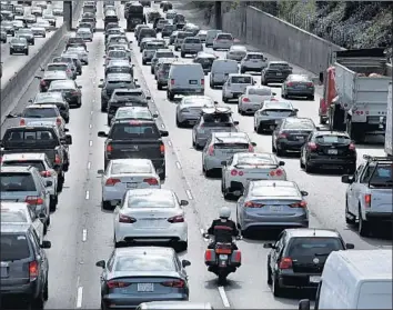  ?? Mel Melcon Los Angeles Times ?? MOTORISTS travel the 101 Freeway in Encino. Senate Bill 1 will raise more than $5 billion annually from a higher fuel tax and a new vehicle registrati­on fee for road repairs and improvemen­t to mass transit.