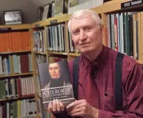  ?? Staff photo by Neil Abeles ?? A new resident of Cass County, Dr. Dan Wimberly brings with him a knowledge and love of history. He’s shown holding his latest book on Cherokee leader Jesse Bushyhead, published in May.