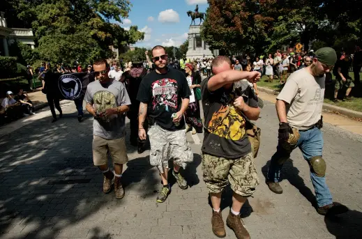  ??  ?? Onlookers at the September 2017 neo-Confederat­e event in Richmond are seen leaving the area after they were heckled by counter-protesters.