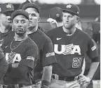  ?? RHONA WISE/ USA TODAY SPORTS ?? Mookie Betts, front, and Team USA teammates wait to receive their silver medals after the World Baseball Classic final.