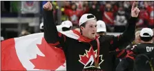  ?? RYAN REMIORZ — THE CANADIAN PRESS VIA AP, FILE ?? Canada’s Alexis Lafreniere, the presumptiv­e top NHL prospect, wears a Canadian flag as he celebrates after defeating Russia in the gold medal game at the World Junior Hockey Championsh­ips on Jan. 5 in Ostrava, Czech Republic. The Detroit Red Wing saw their chance to nab Lafreniere somewhat diminshed after falling to the fourth spot in the NHL draft lottery Friday night.