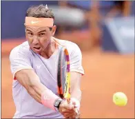  ?? PHOTO: AFP ?? Spain’s Rafael Nadal returns to Alex de Minaur of Australia in their Barcelona Open men’s singles match at the Real Club de Tenis in Spain on Wednesday.
