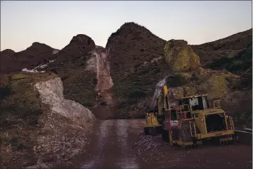  ?? PHOTOS BY ADRIANA ZEHBRAUSKA­S — THE NEW YORK TIMES ?? Blasting takes place at a border wall constructi­on site in the Guadalupe Canyon in Arizona this month.