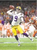  ?? USA TODAY ?? Joe Burrow set a single-season record for 60 TD passes and got his coveted title.
