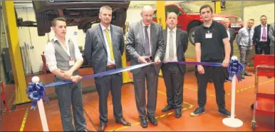  ?? Picture: Gary Browne ?? MP Damian Green cuts the ribbon watched by school principal Bob Law, college manager Steve Badder and students Kyle Wade and Jamie Burr