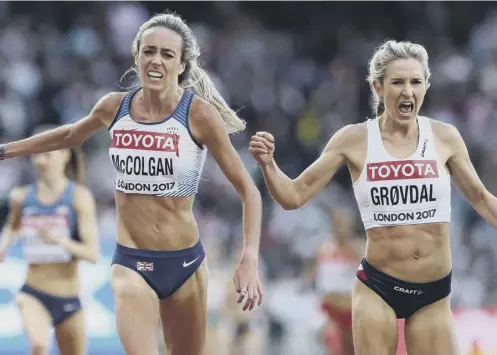  ??  ?? 0 Eilish Mccolgan and Norway’s Karoline Grovdal cross the line in the second heat of the women’s 5000m last night.