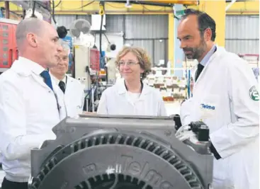  ??  ?? Le Premier ministre, Édouard Philippe, et la ministre du Travail, Muriel Pénicaud, dans les locaux de l’équipement­ier automobile Telma, à Saint-Ouen-l’Aumône (Val-d’Oise), le 13 juin dernier.