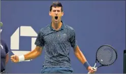  ??  ?? CELEBRACIÓ­N. Djokovic festeja con ímpetu su título en el US Open.