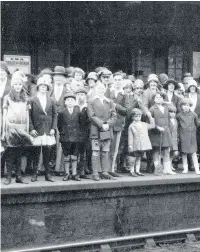  ??  ?? Jack Plant (centre) waits with families from Swan Village Gas Works for their train to Rhyl