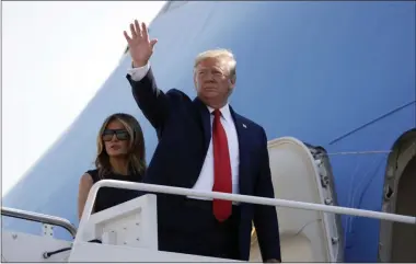  ?? EVAN VUCCI — THE ASSOCIATED PRESS ?? On Aug. 7, President Donald Trump and first lady Melania Trump board Air Force One for a trip to Dayton, Ohio and El Paso, Texas, at Andrews Air Force Base, Md. As Trump prepares to leave Friday for his annual August holiday at his lush New Jersey golf club, the president will confront a storm of crises, at home and abroad, that could set the course for his upcoming re-election bid.