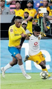  ?? Picture: GALLO IMAGES ?? CLOSE TUSSLE: Motjeka Madisha, left, of Mamelodi Sundowns and Dumsani Zulu of Kaizer Chiefs battle it out in 2019. Coach Pitso Mosimane said Madisha’s bad day in the Nedbank Cup match will not be held against him. .