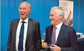  ?? REUTERS PIC ?? Then Liberal Party member of parliament John Alexander (left) with Australian Prime Minister Malcolm Turnbull during a visit to a printing company in Sydney in April.