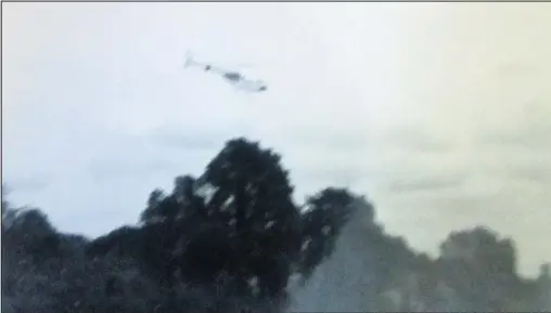  ??  ?? A helicopter landing in the garden of a big house in Castledine Street, Loughborou­gh in the 1970s.