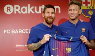  ?? AP ?? Lionel Messi and Neymar pose with new jersey during a press conference. —