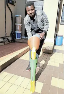  ?? /TWITTER ?? Uku’hamba founder and owner Sibongile Mongadi with some of the prosthetic legs she manufactur­es.