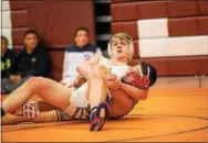  ?? NATE HECKENBERG­ER — DIGITAL FIRST MEDIA ?? Dan Labus of West Chester Rustin scores near-fall points against Owen J. Roberts’ Ricky McCutchen on his way to a 13-4 major decision at 152 pounds in the consolatio­ns of the District I Duals at Pottsgrove High School on Friday.