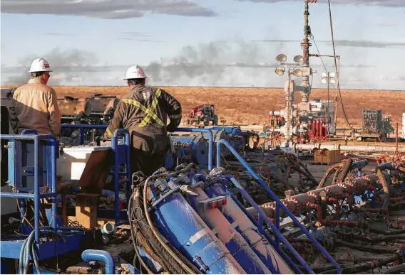  ?? The Oilfield Photograph­er Inc. ?? A BJ Services frack crew operates on a well site near Eunice, N.M., in January. The Texas-based oil field services provider filed for Chapter 11 bankruptcy protection in July. The Dallas law firm Haynes and Boone, which tracks oil patch bankruptci­es, predicts more will be coming before year’s end.