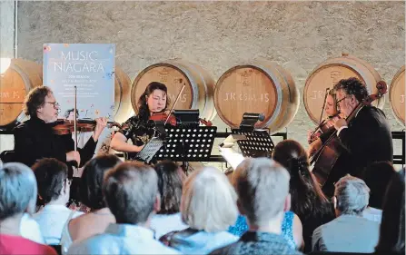  ?? SCOTT ROSTS METROLAND ?? The Gould String Quartet — Atis Bankas (violin), Vera Alekseeva (violin), Anna Antropova (viola) and Jonathan Tortolano (cello) — play Mozart and Mendelssoh­n string compositio­ns during a Music Niagara performanc­e Saturday at The Hare Wine Co. in Niagara-on-the-Lake. The festival, marking its 20th anniversar­y, welcomes the National Youth Orchestra to FirstOntar­io Performing Arts Centre in St. Catharines, on Thursday.