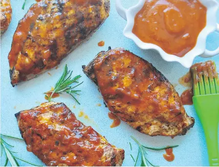  ?? ERIC AKIS ?? Rhubarb BBQ sauce is slathered on grilled chicken breasts.