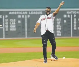  ?? Maddie Meyer, Getty Images ?? David Ortiz throws out the ceremonial first pitch before Monday’s game between the Red Sox and the Yankees at Fenway Park in Boston.