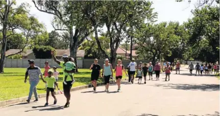  ?? Picture: SIPHOKAZI VUSO ?? PEACEFUL STROLL: Young and old enjoy the 12th annual Gandhi Walk which was held in Nahoon on Sunday