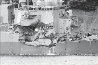  ?? EUGENE HOSHIKO / AP ?? Damage to the USS Fitzgerald is seen Sunday at the U.S. Naval base in Yokosuka, southwest of Tokyo. Seven U.S. sailors died after the Fitzgerald collided with a container ship in the busy sea off Japan.