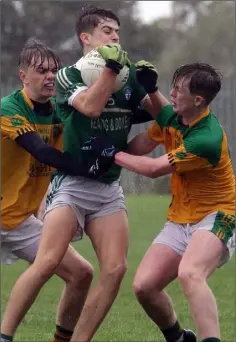  ??  ?? Liam Crowley and Kyle Rankin of Our Lady’s Island/St. Fintan’s pile the pressure on Cloughbawn’s Darragh Kehoe.