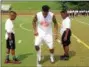  ?? JOHN KAMPF — THE NEWS-HERALD ?? Browns defensive back Joe Haden works with campers at his Skills Academy on July 21 at University School.