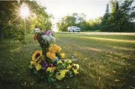  ?? LARS HAGBERG/GETTY-AFP ?? Flowers rest Tuesday outside a home where one of the stabbing victims was found in Weldon, Saskatchew­an. In all, 10 people were killed and 18 wounded.